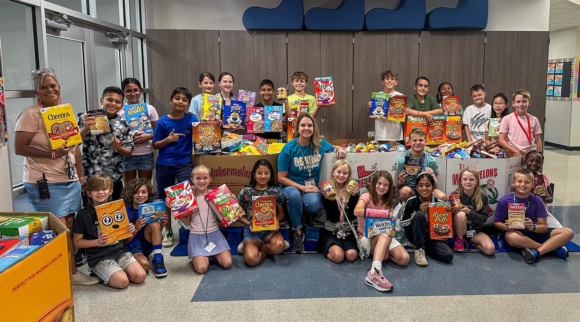 Wellington Elementary students and staff pose with donations for the LISD Stuff the Pantry Food Drive. October 2024